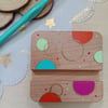 Hand painted circular patterned wooden phone stand 