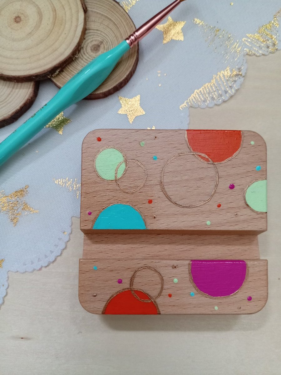 Hand painted circular patterned wooden phone stand 
