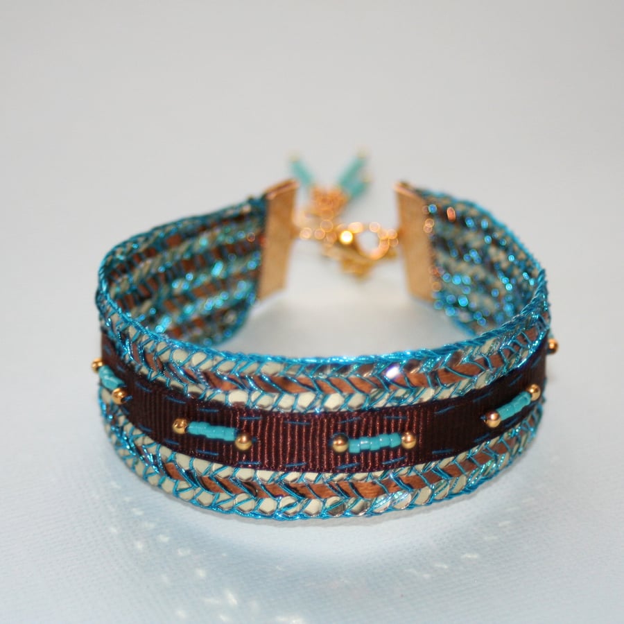 Turquoise, gold and brown ribbon cuff bracelet