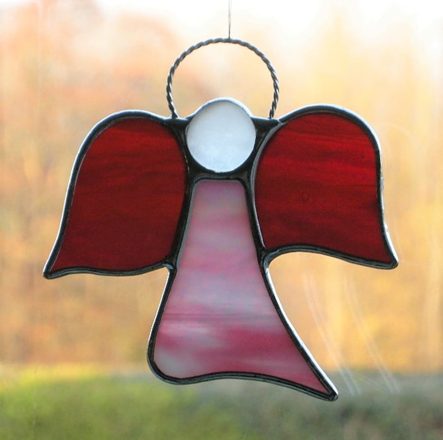 Stained glass (Angel) abstract in red and pink opalecent iridescent glass