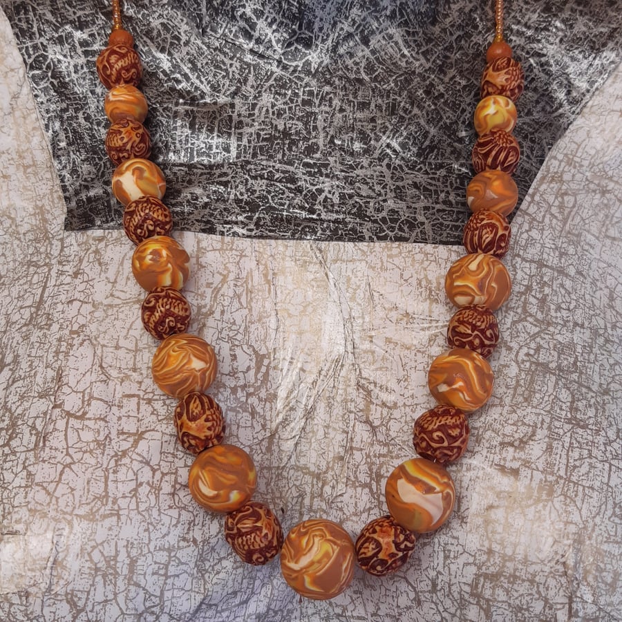 Orange, cream and  peanut brown polymer clay necklace