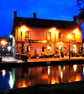 Kingsbridge Inn Bourton On The Water Cotswolds Photograph Print - Image 1