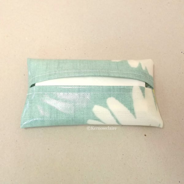 Tissue holder in turquoise oilcloth with a daisy pattern, tissues included