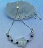 Silver plated slider bracelet with white quartz star and black spinel stones