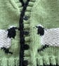 Green baby cardigan with sheep designs on the front - Image 6