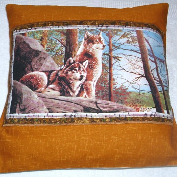 Wolves sitting up on a rocky ledge in Autumn cushion