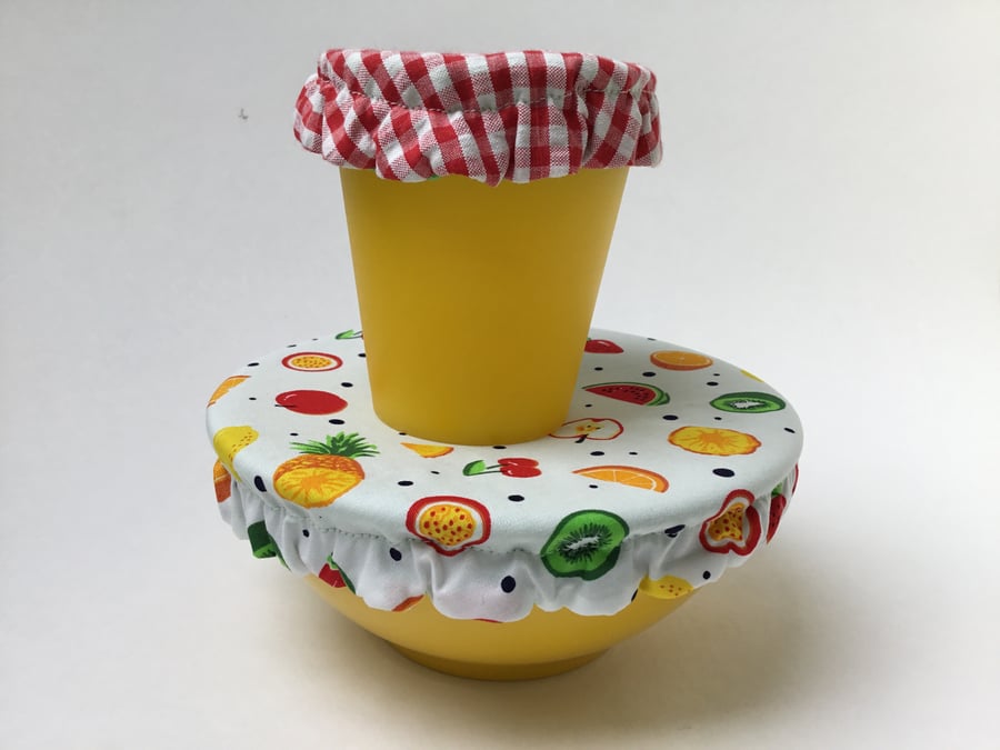 Seconds Sunday . 2 small-sized reusable bowl covers. Fruit and checks