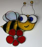 Handmade cute stained glass bee on flower
