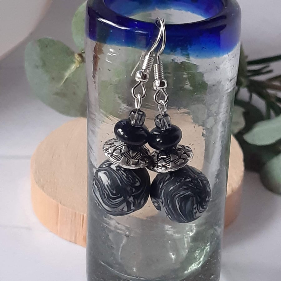 Black and silver dangly earrings