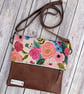 Folded crossbody bag with genuine leather and pretty floral fabric