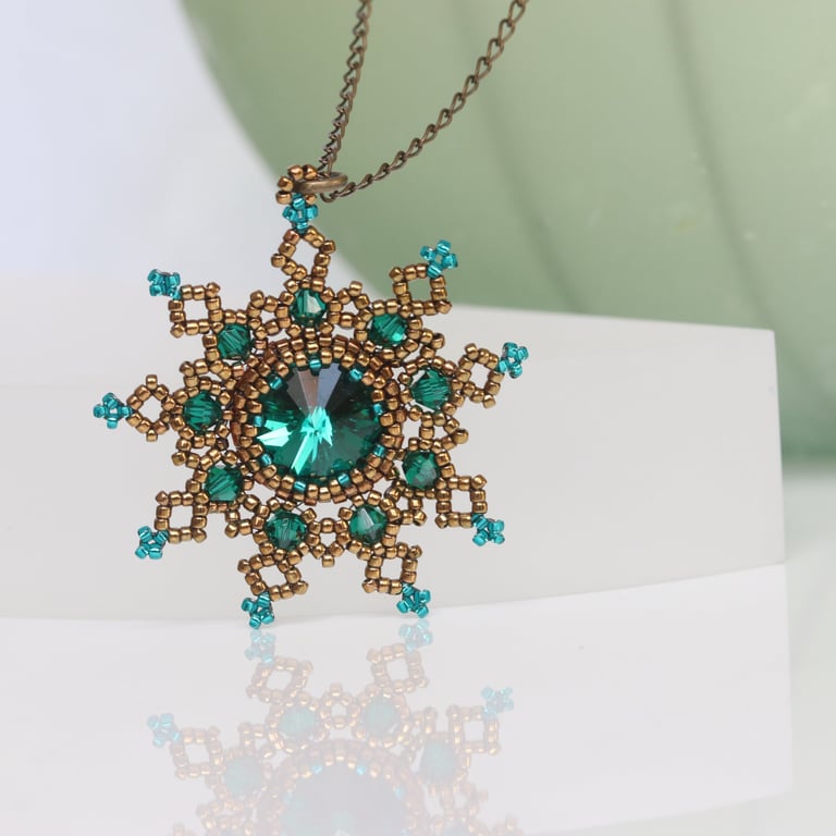 Bronze and Emerald Snowflake Pendant