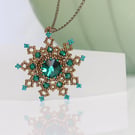 Bronze and Emerald Snowflake Pendant