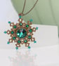 Bronze and Emerald Snowflake Pendant