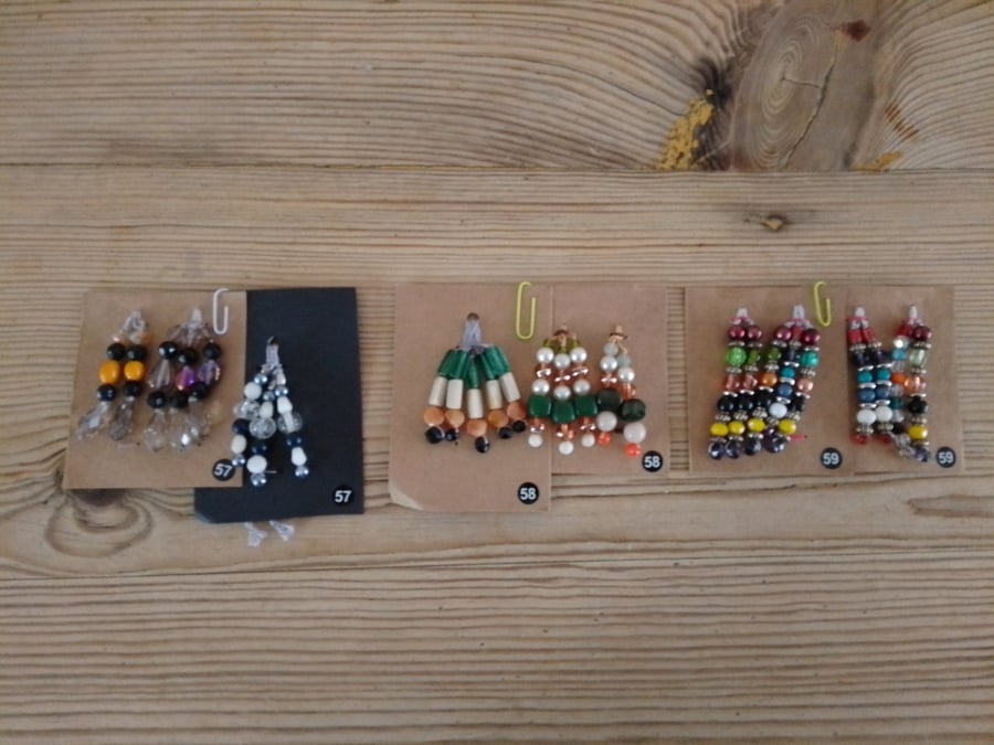 Set of colour coordinated beaded gift decorations.