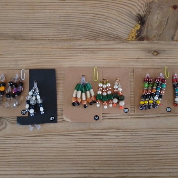 Set of colour coordinated beaded gift decorations.