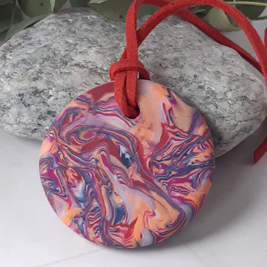 Round polymer clay pendant in bright pink colours