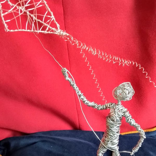 Let's go fly a kite up to the highest height.. figure made out of wire .