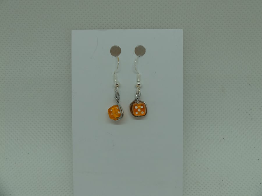 Pairs of hand made white metal earrings with dice beads