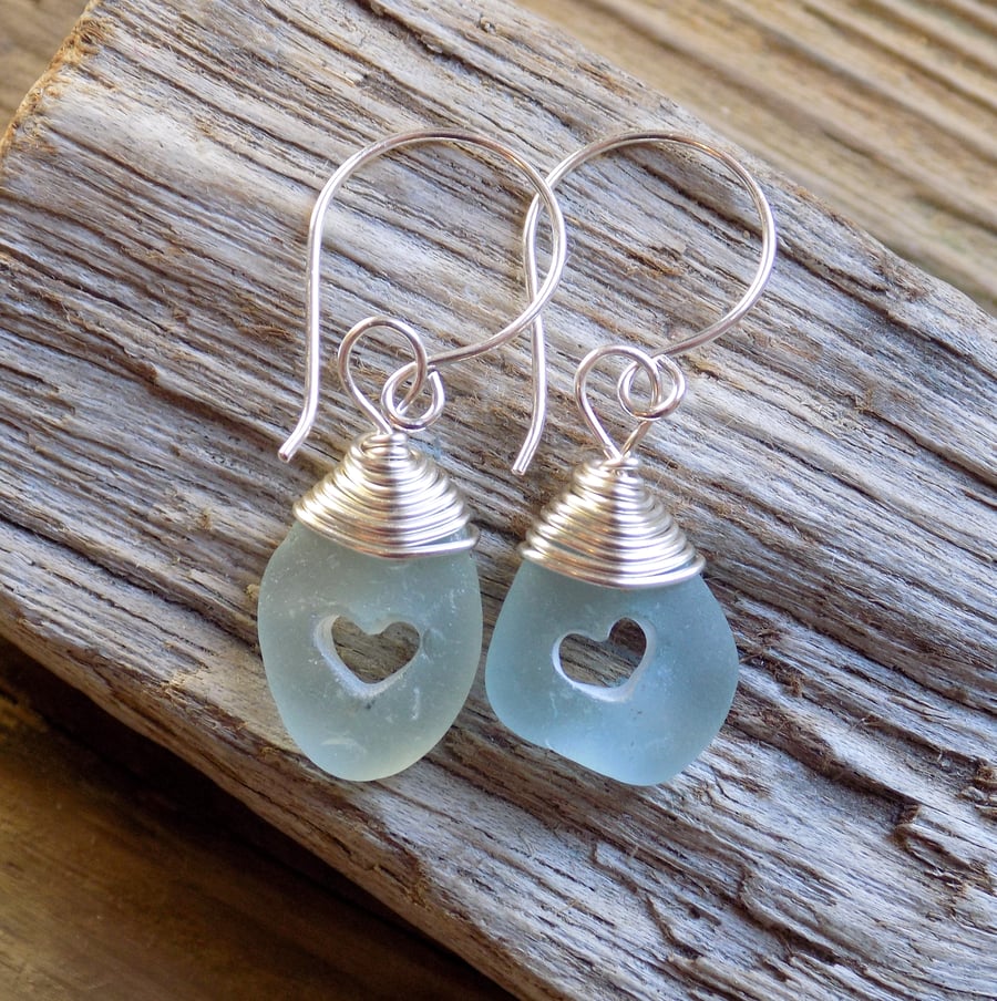 Drilled heart , wire wrapped sea glass earrings 