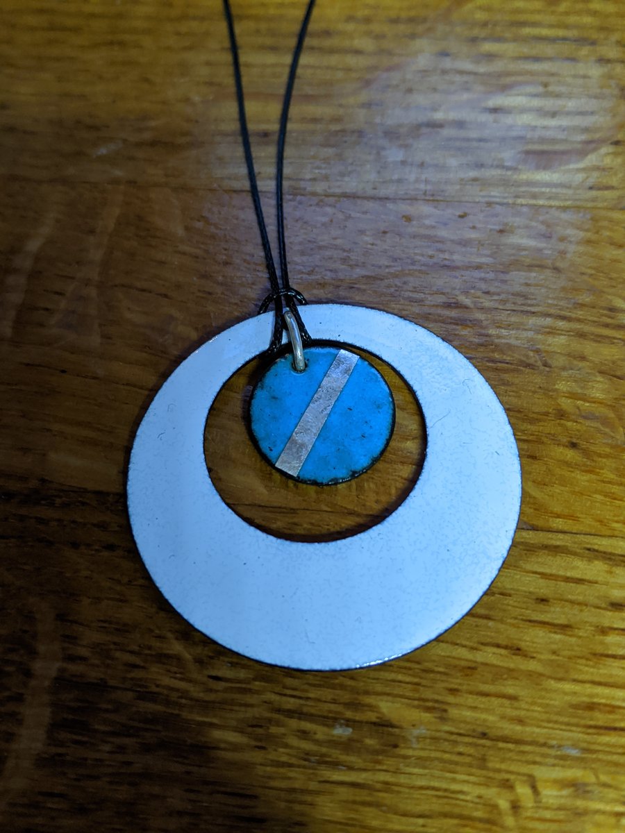 Vitreous white and blue enamel with silver leaf on copper pendant