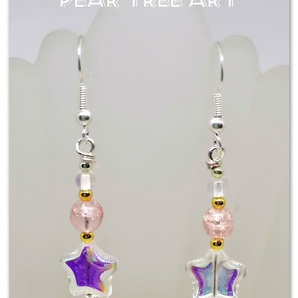 Clear glass star bead earrings with pink beads on silver plated hooks.