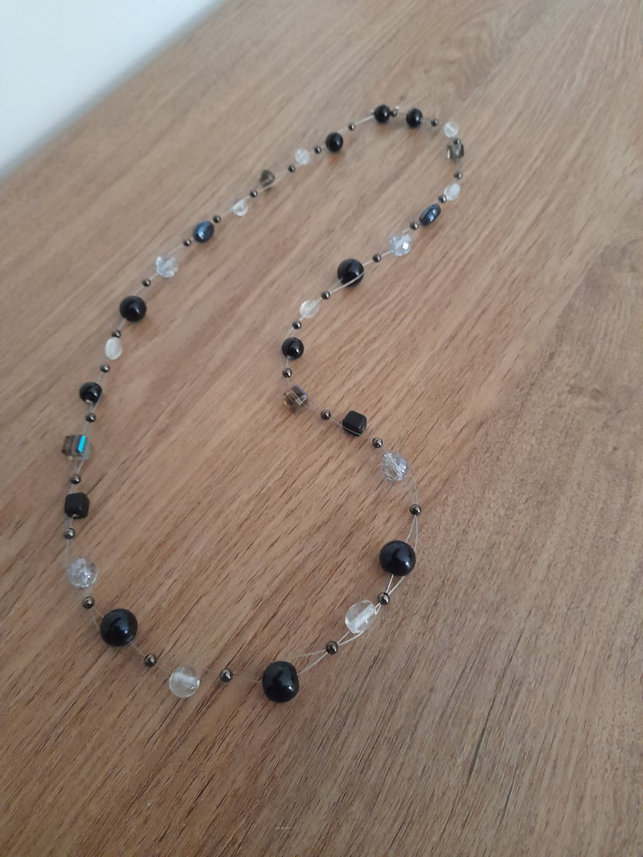 SHADES OF BLACK, CLEAR AND CRYSTAL BEAD NECKLACE.