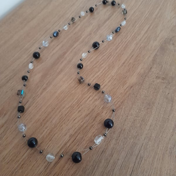 SHADES OF BLACK, CLEAR AND CRYSTAL BEAD NECKLACE.