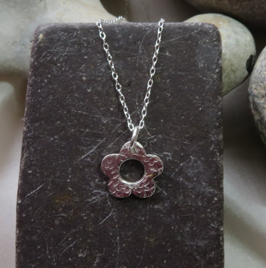 small silver flower pendant