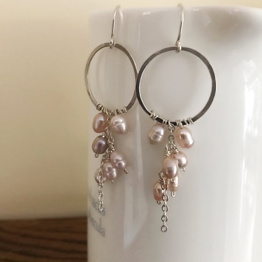 Sterling silver hoop earrings with a pink freshwater pearl cluster