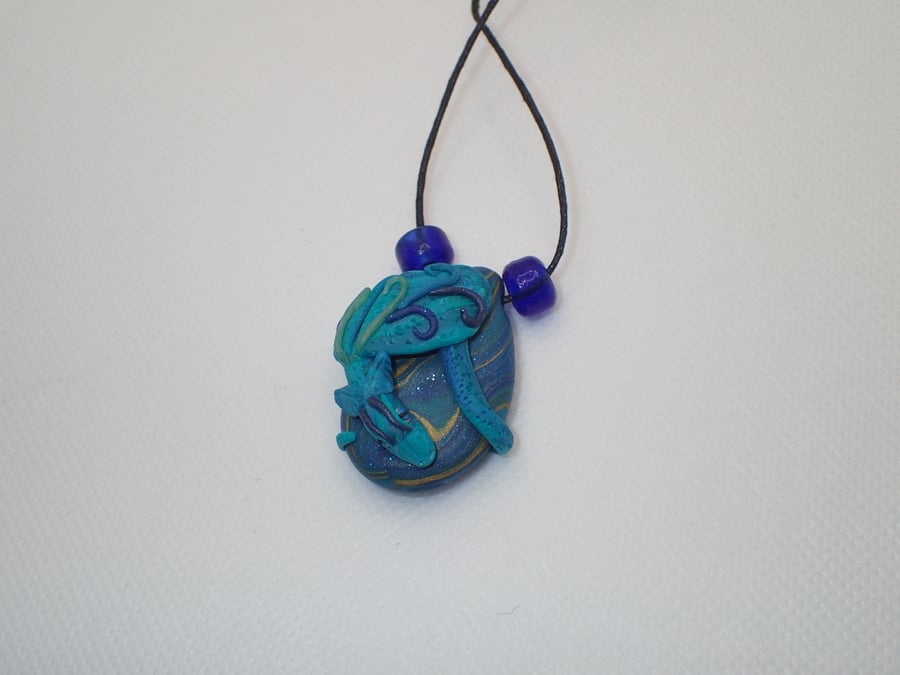 Blue polymer clay dragon pendant