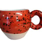 Ceramic wheel thrown Red and black Speckled Round Huggable mug . - Image 1