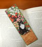 Bookmark black and white cat in the garden - Image 1