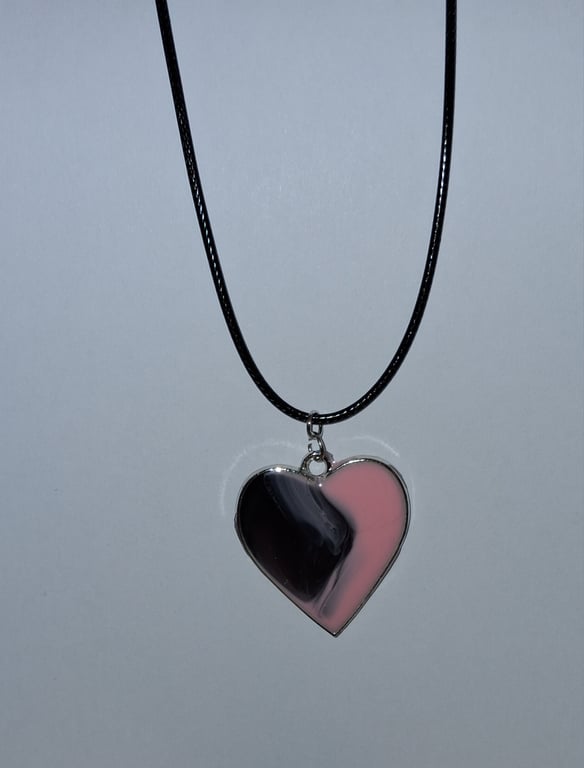 Handmade resin black and pink heart pendant on  black waxed cord