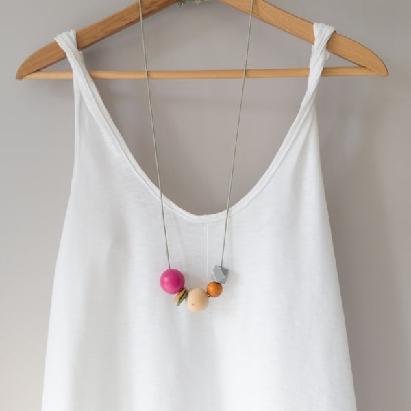 Isla - Hot pink, olive green, burnt orange necklace with grey hexagonal bead
