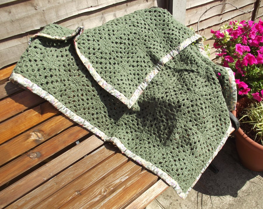 green hand crocheted blanket