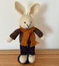 Hand Knitted Rabbit in Vargated Jumper and Purple Trousers 