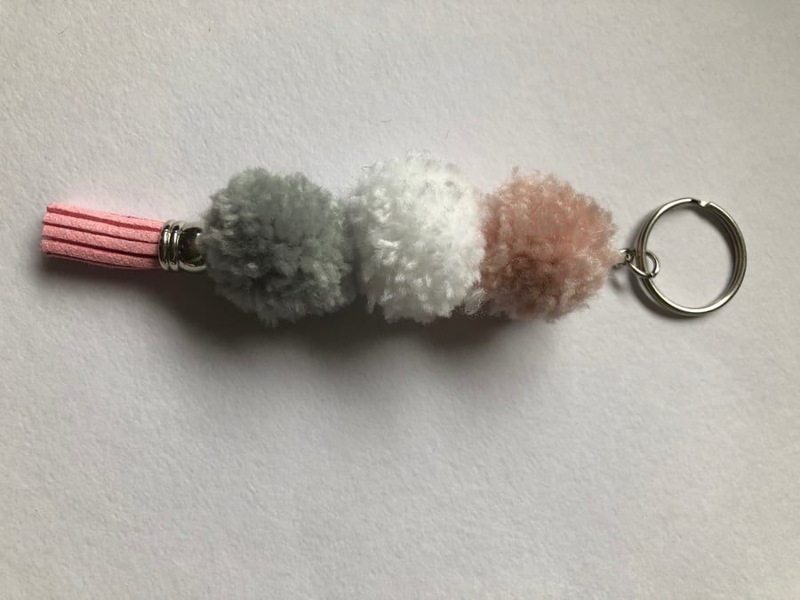 Cute Pom Pom keyring pink grey and white with a lovely pink faux suede tassel 
