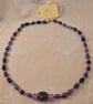 Purple paper and glass beaded necklace with purple accent beads