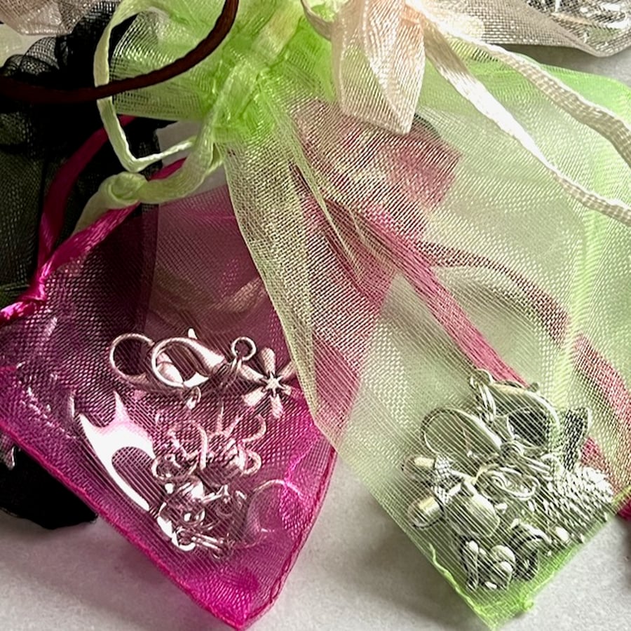 Zipper pulls, stitch markers, clip on charms for purse or planner, four charms.