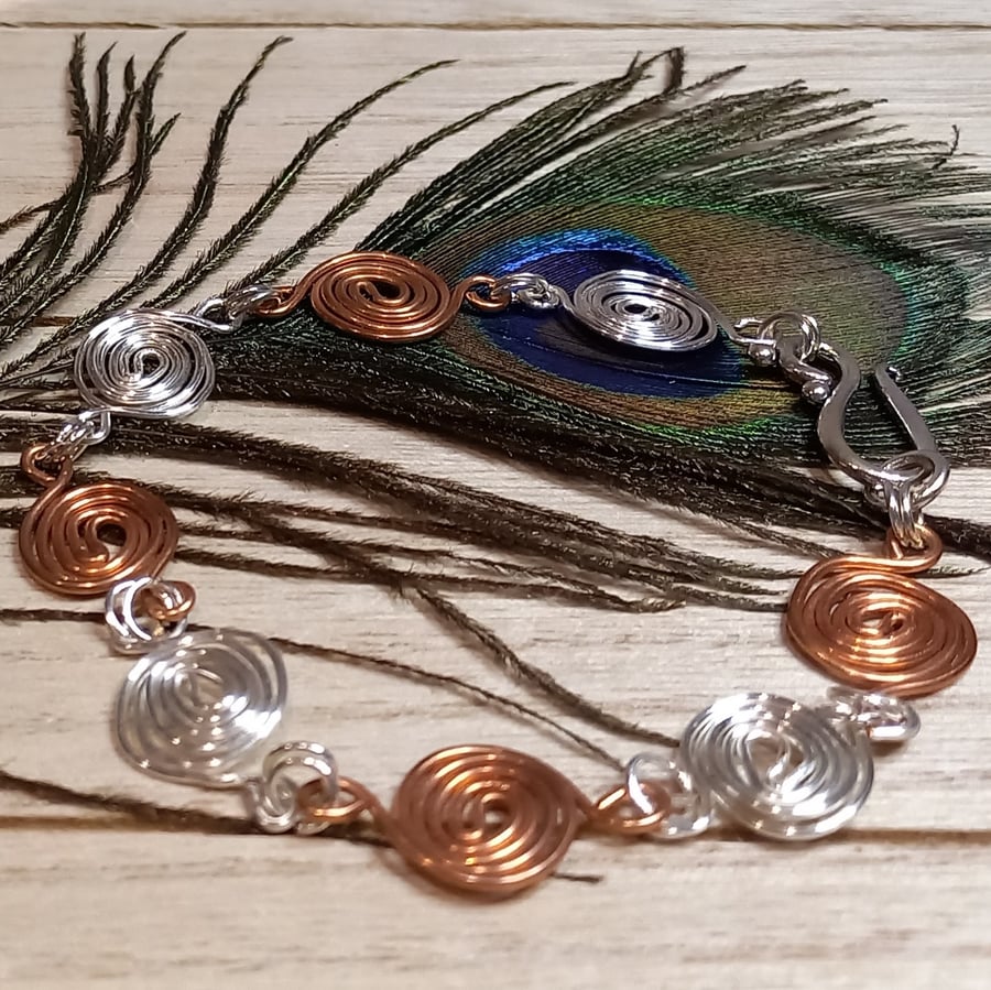 Copper Bracelet made with swirls of copper and silver plated copper wire