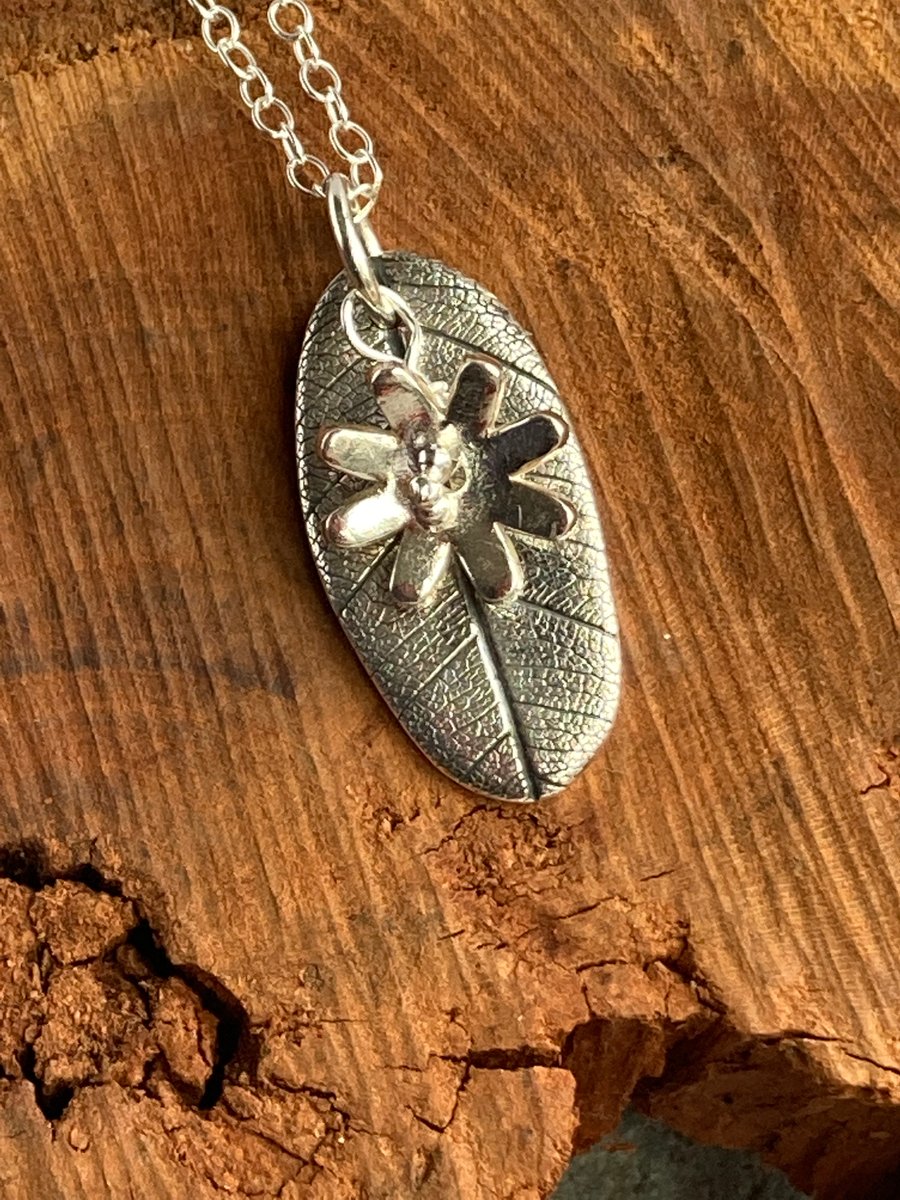 Silver leaf and flower pendant