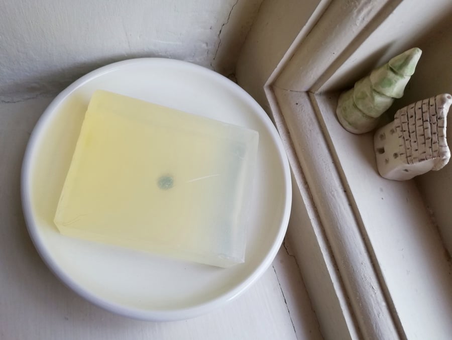 White stoneware soap dish with drainage hole and 3 feet hand thrown ceramic