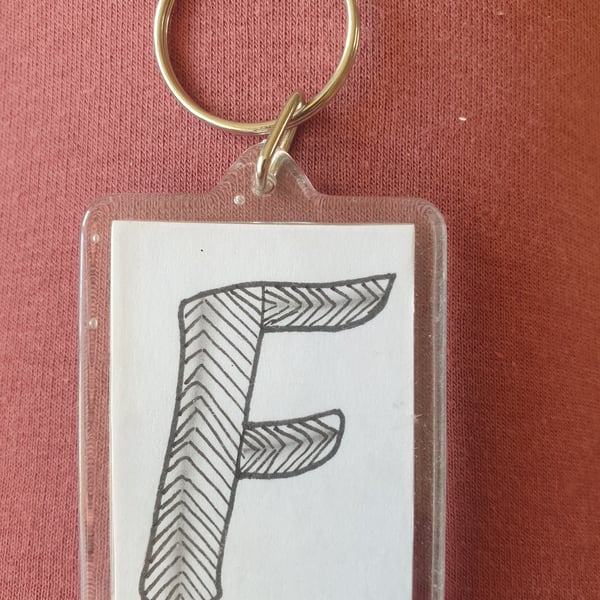 Hand drawn initial "F" keyring.