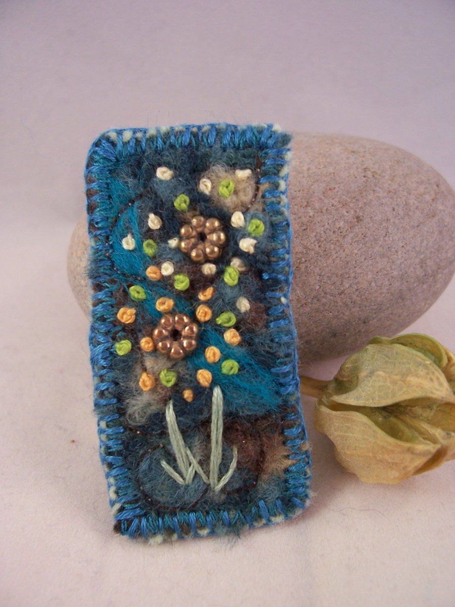 Needle felted and hand embroidered brooch