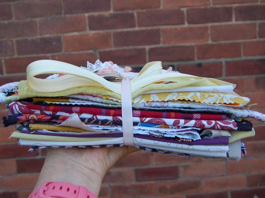 Upcycled slow stitching kit includes fabric, buttons, thread, lace, ribbon