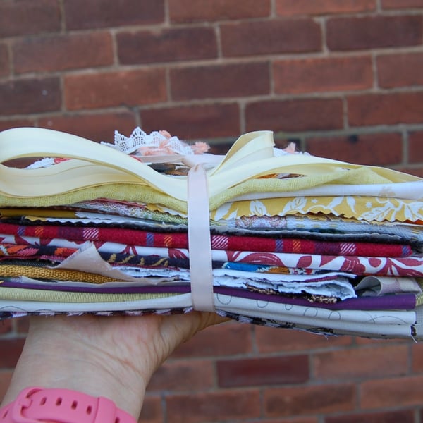 Upcycled slow stitching kit includes fabric, buttons, thread, lace, ribbon