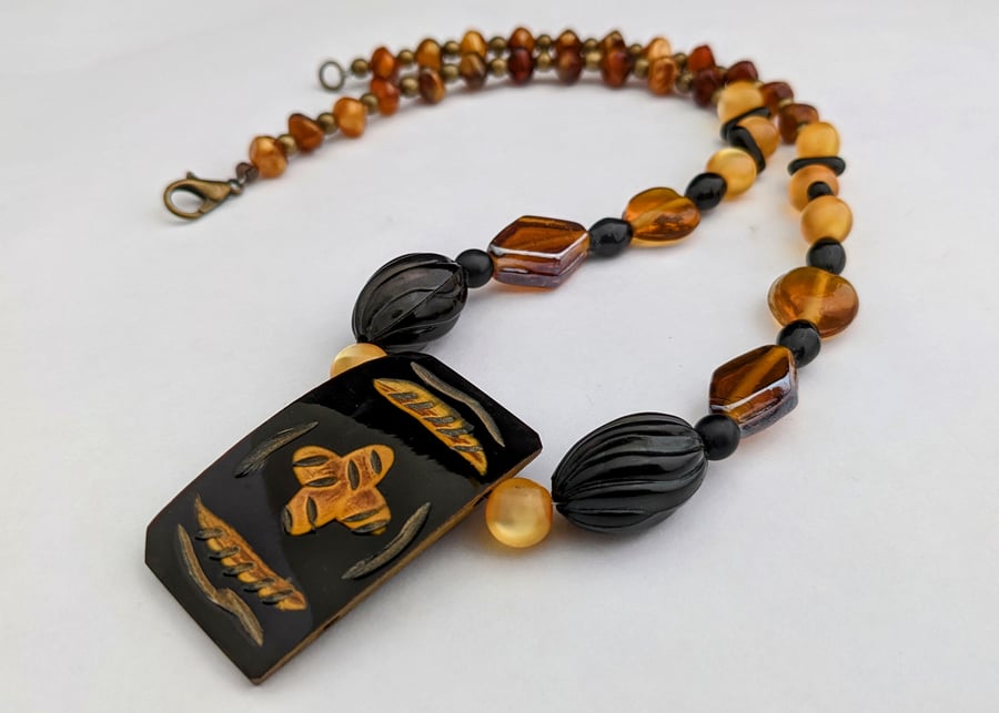 Black and orange ethnic beaded necklace - 1002651