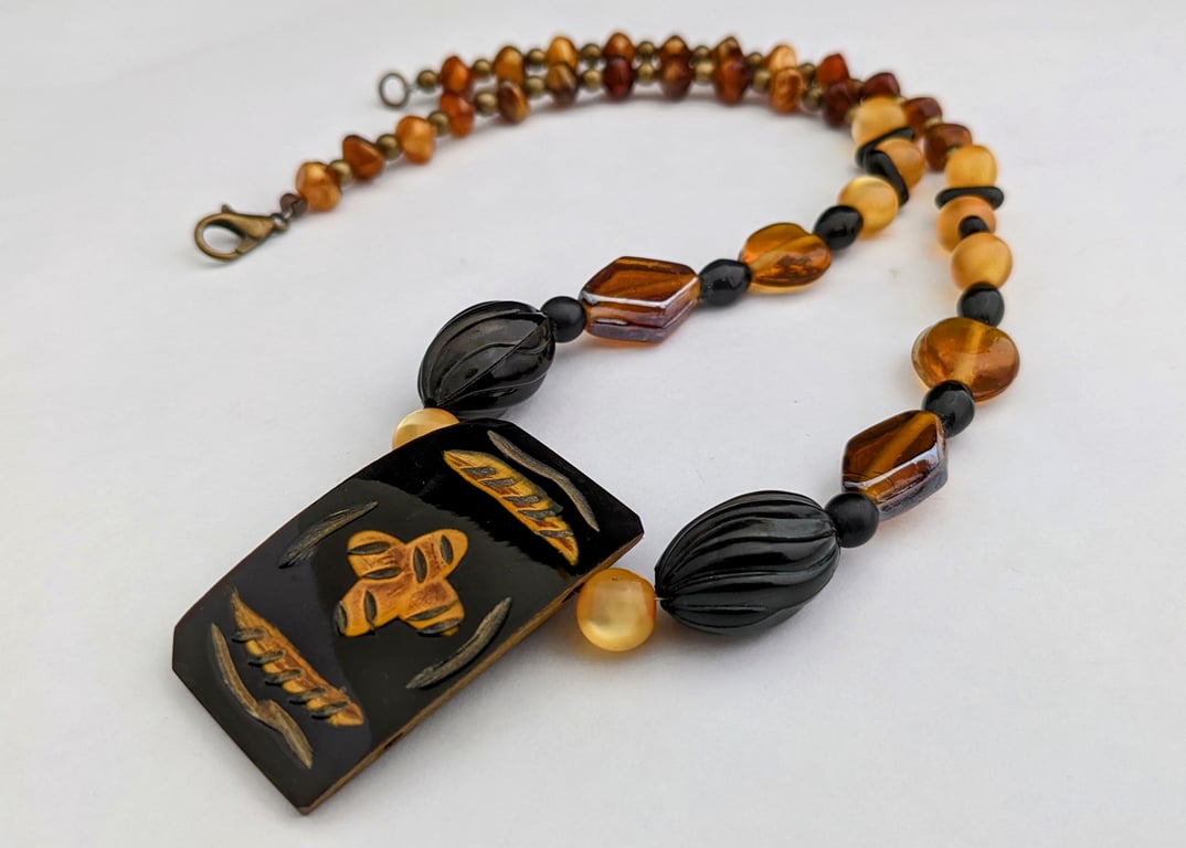 Black and orange ethnic beaded necklace - 1002651