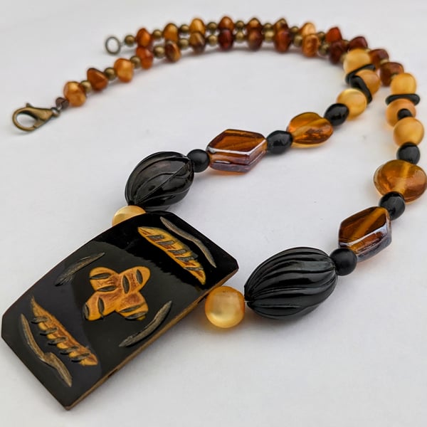 Black and orange ethnic beaded necklace - 1002651