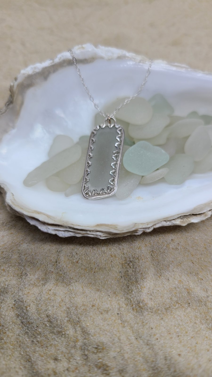 Light grey sea glass and silver pendant P12